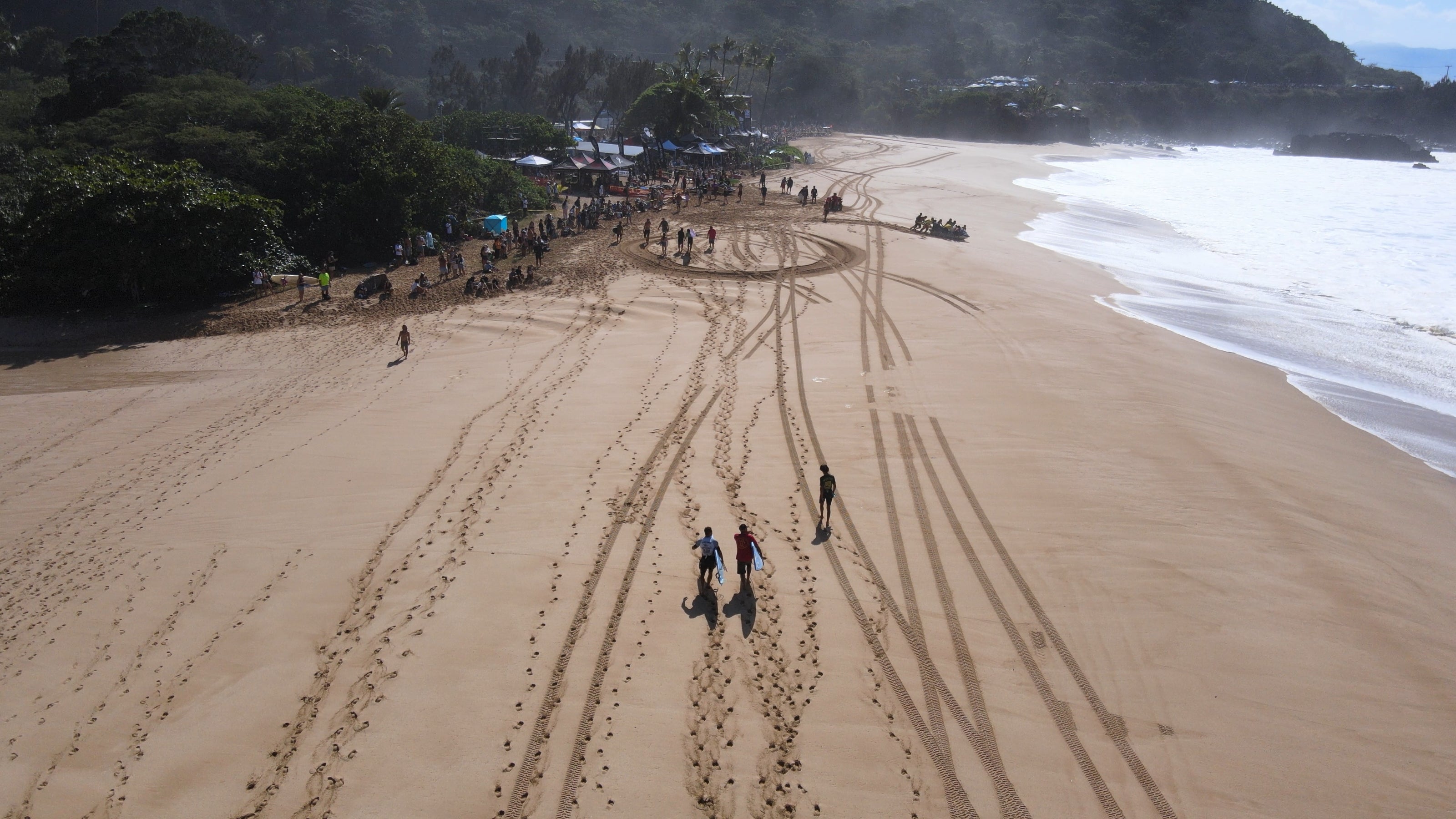 Surfers walking together at the Eddie Aikau Big Wave Invitational 2024.