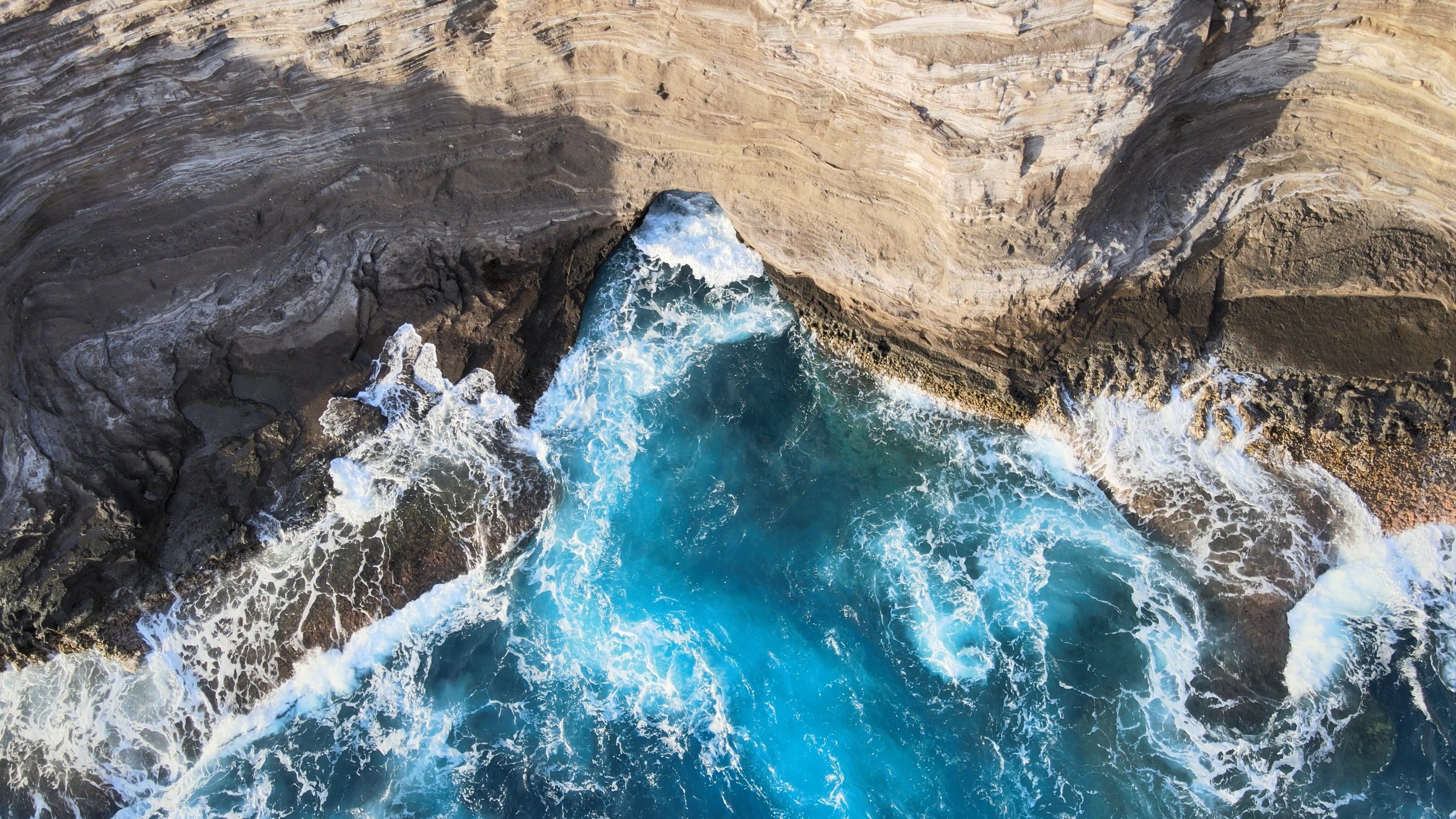Nadir  drone footage of spitting caves in Hawaii.