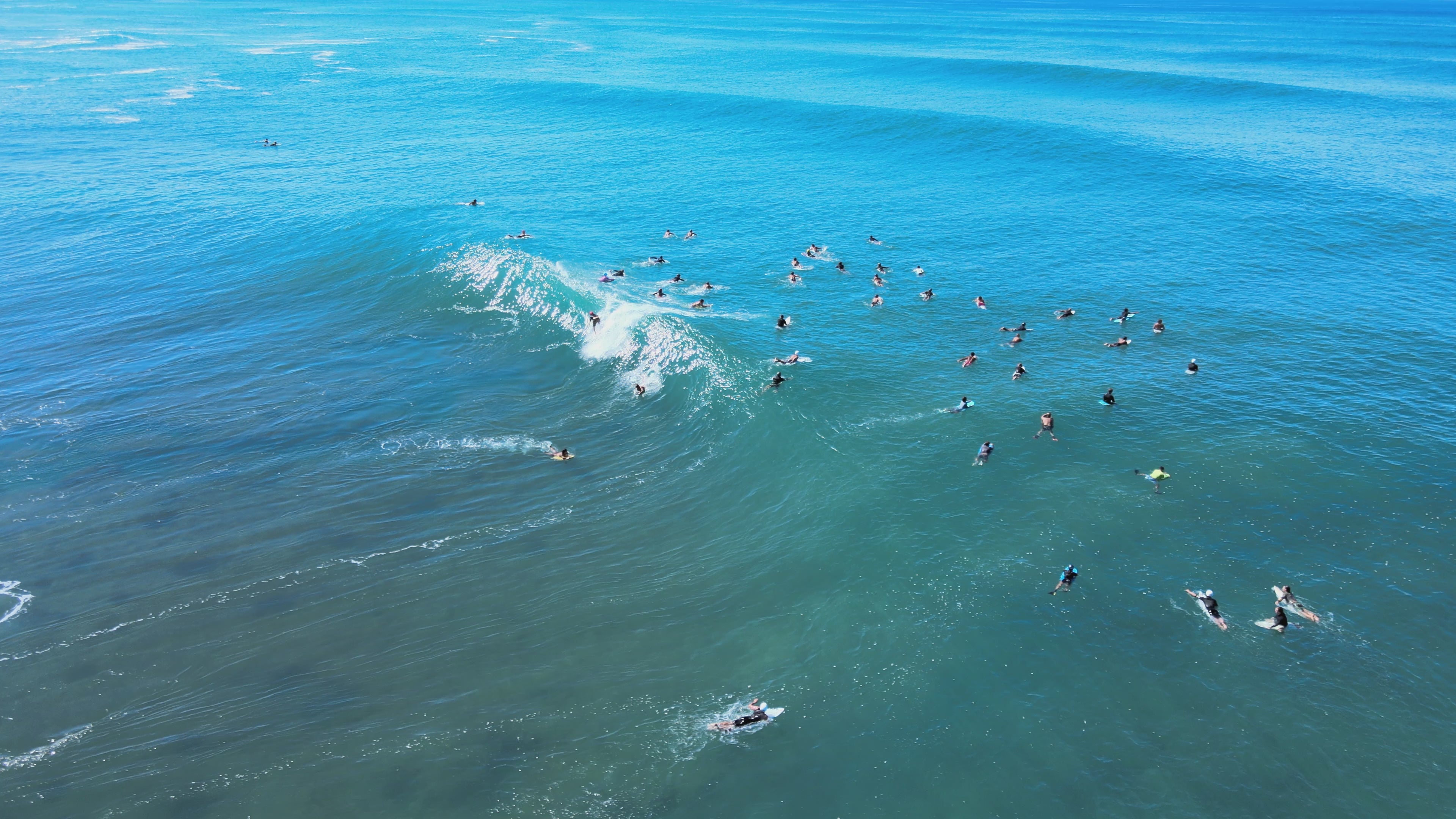 Load video: Body surfer doing a backflip trick on a huge wave in Hawaii.